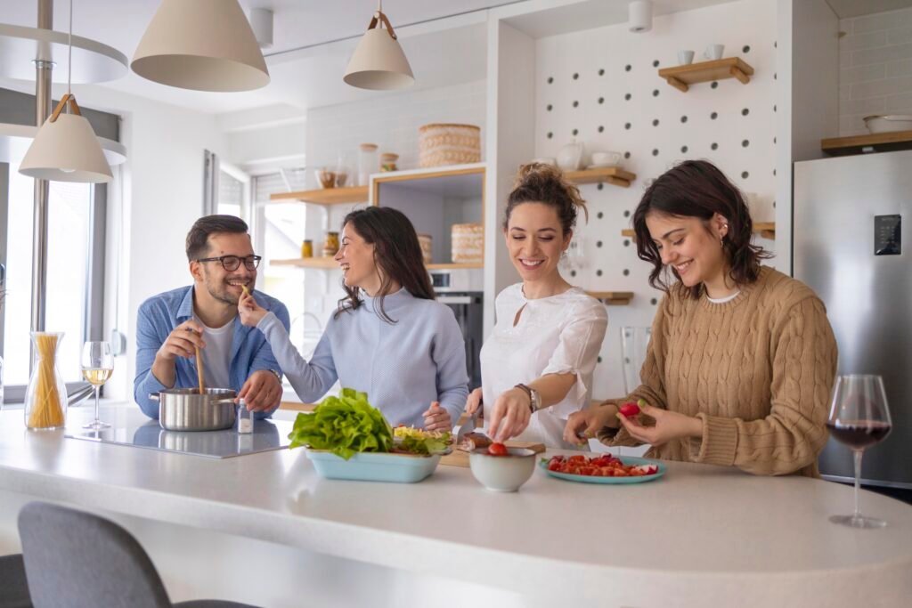 group-friends-preparing-meal-kitchen