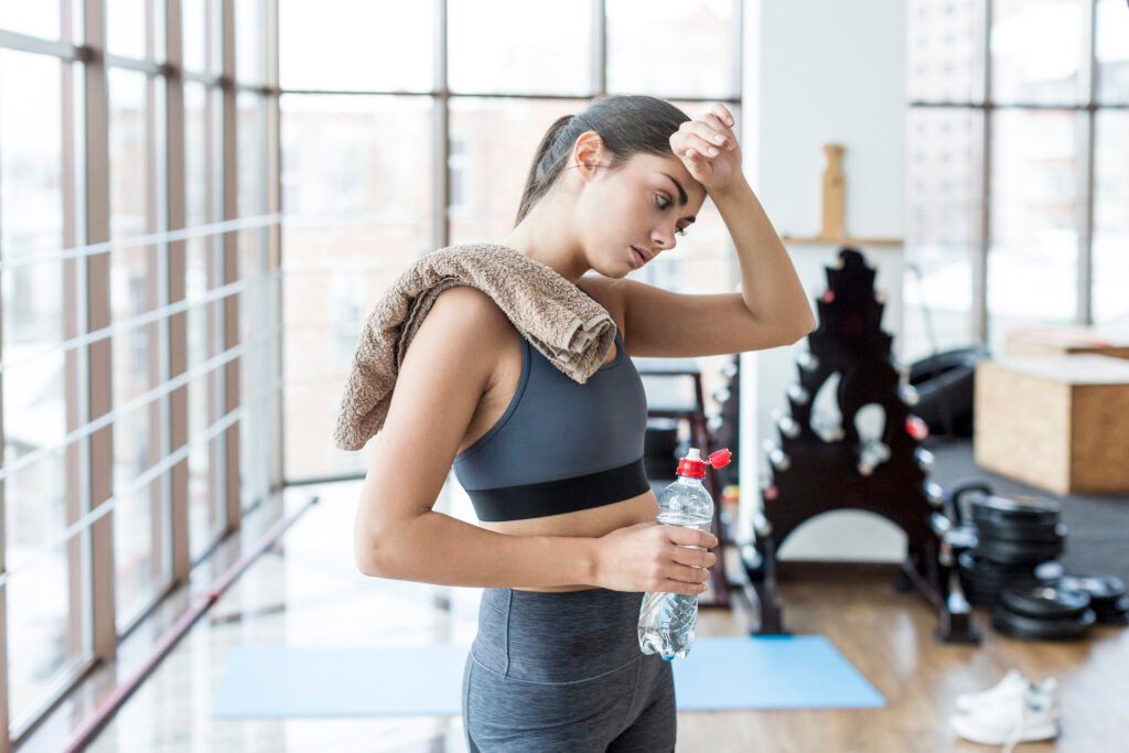 woman-with-towel-water-wiping-face